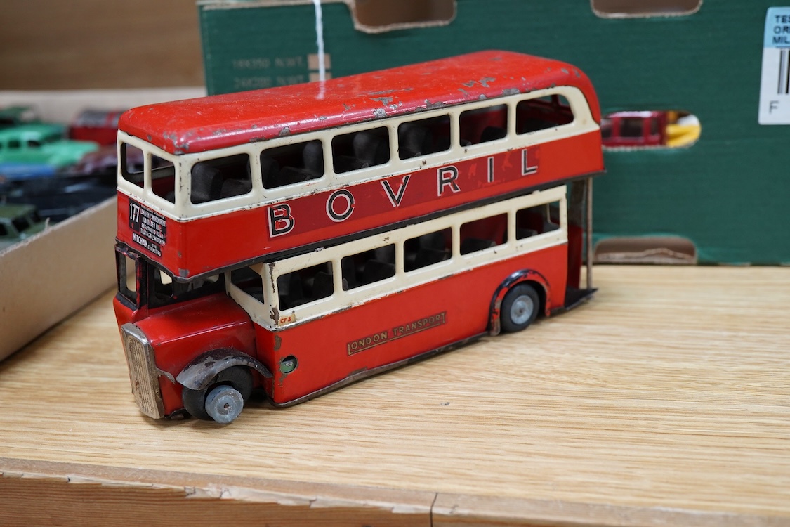 Twenty-seven Dinky Toys and Tri-ang Minic clockwork tinplate vehicles, including Dinky 38 and 39 series British and American cars, a Foden DG flatbed, a Tri-ang Minic double deck London Transport bus, two refuse wagons,